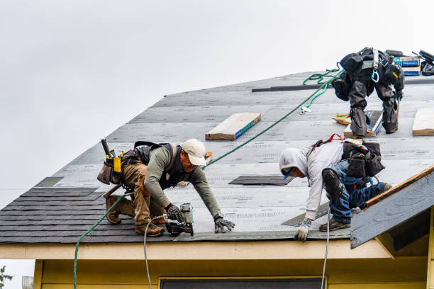 Professional Roofing technician working in East Middlebury, VT